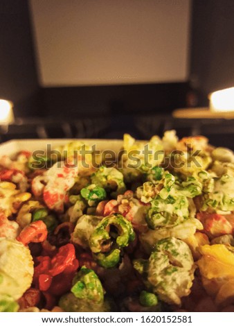 sweet colorful popcorn inside a cinema ready to enjoy the film