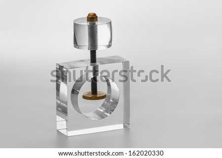 Acrylic objecto to broke things, specially walnuts, nut. Isolated transparent object with white background.