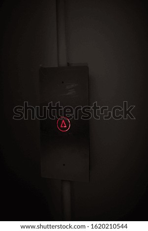 Elevator Button up red on stainless plate concept business dark detail office building space for text future darkness