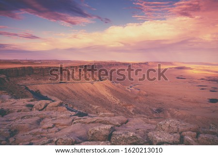 Beautiful dramatic sunset over desert. Wilderness. Nature landscape. Makhtesh Ramon Crater, Israel
