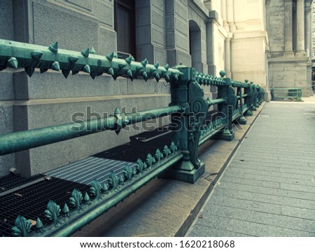 Green iron gothic handrail in Philadelphia outside of City Hall.