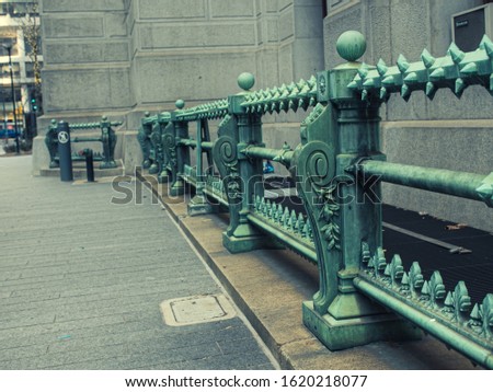 Green iron gothic handrail in Philadelphia outside of City Hall.