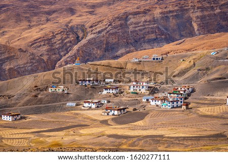Panoramic view of Langza village in the cold desert valley of Spiti in the Himalayas of Himachal Pradesh, India. It is famous for fossils of marine animals  which are in Tethys sea millions year ago. Royalty-Free Stock Photo #1620277111
