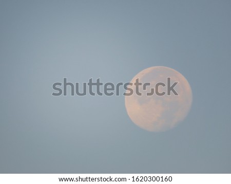 Blue background with pink moon