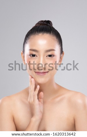 Beautiful Asian young woman touching soft cheek smile with clean and fresh skin Happiness and cheerful with positive emotional,isolated on white background,Beauty and Cosmetics Concept 