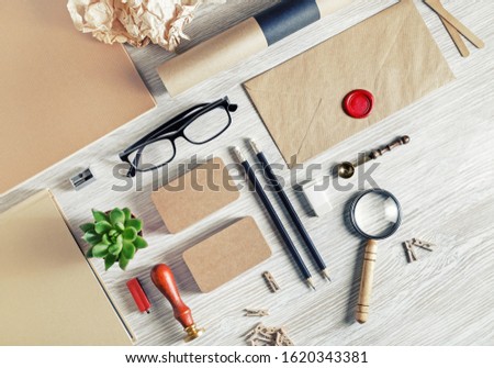 Blank stationery set on light wood table background. ID template. Mockup for branding identity for designers. Flat lay.