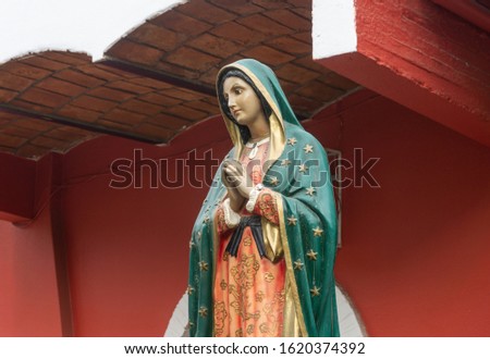 Virgin of Guadalupe, Homage Statue located in Sayulita Mexico. Royalty-Free Stock Photo #1620374392