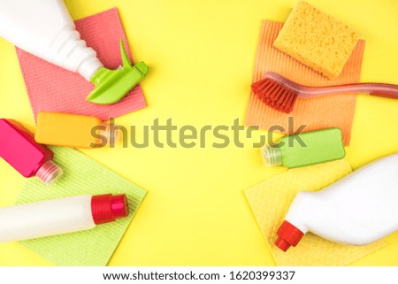House cleaning products are on yellow background. Cleaning concept.