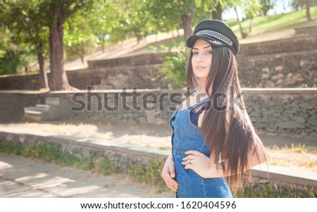 Portrait of young woman in the outdoor.