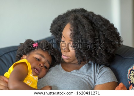 African American mother parenting her young child.