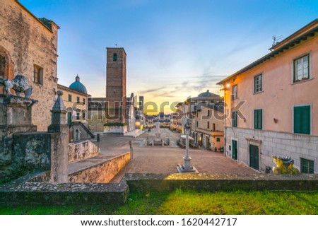 Pietrasanta old town view at sunset, San Martino cathedral and torre civica. Versilia Lucca Tuscany Italy Europe Royalty-Free Stock Photo #1620442717