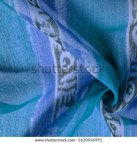 Texture, background, design, abstract pattern on the fabric, a large braided thread, a pattern of blue white lines, this fabric for your projects