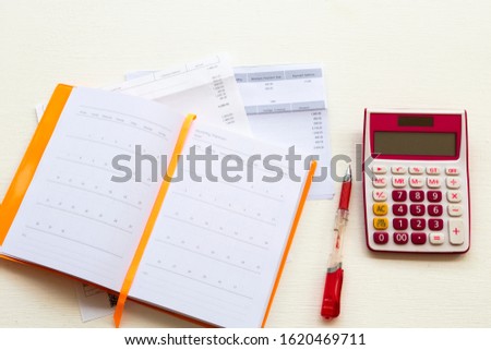 credit card statement due expenses ,calculater ,notebook planner for business work arrangement at office desk on background white 