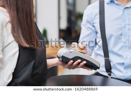 Paying by credit card in hair salon 