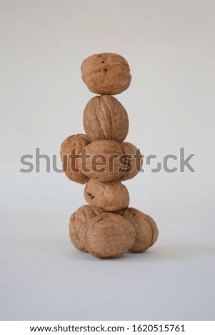 Heap of walnuts on a white background