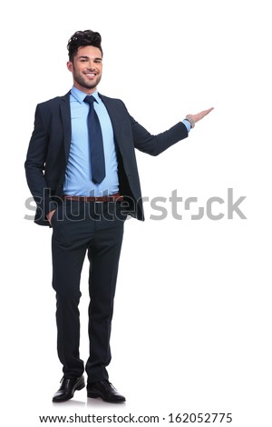 full body picture of a happy business man presenting something on a white background