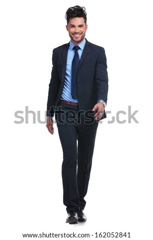 full body picture of a young smiling business man walking forward towards the camera on white background