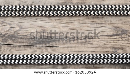 frame of rope on a old wooden background 