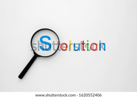 Magnifying Glass Focus on solution word "S" .