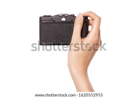 Woman hand hold a vintage camera