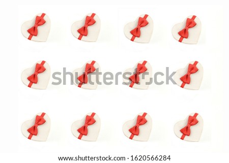 gift box in the form of a heart with a red bow on a white background.  gift box pattern