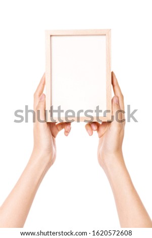 Woman hand hold a photo frames isolated on white.