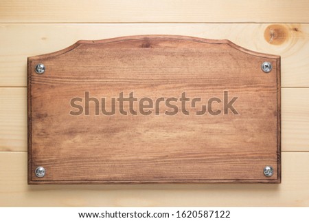 nameplate or wall sign at  wooden background texture surface, with screws Royalty-Free Stock Photo #1620587122