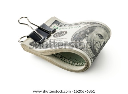 Dollars in stationery clip isolated on a white background