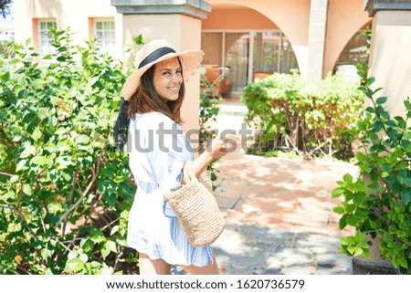 Young beautiful woman smiling happy enjoying sunny day of summer at hotel resort on holidays