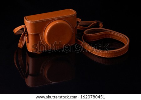 Retro leather camera case black background