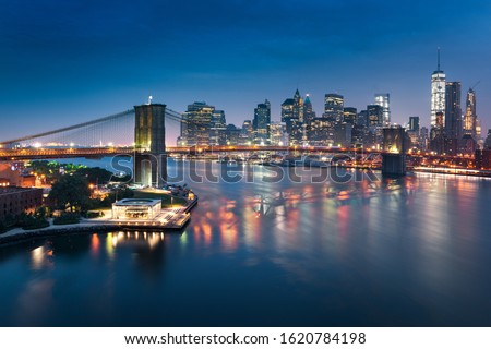 New York City skyline with urban skyscrapers at sunrise, USA.