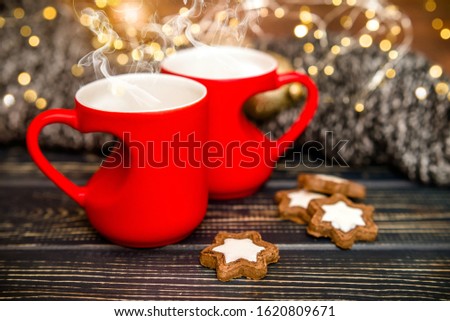 Mugs in the shape of a heart on a festive background
