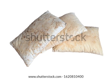 Old dirty pillow with saliva stain and fungus cause of illness, isolated white background with clipping path