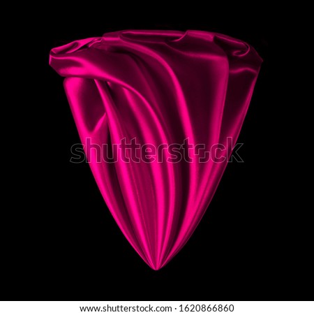 Satin red fabric on a black background. Abstract design. Fabric in the shape of a flower.