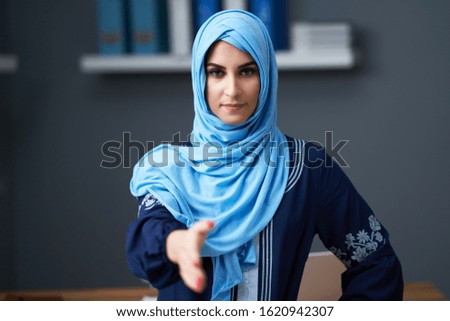 Muslim female student learning at home