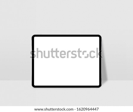 Digital tablet with empty screen. Tablet mockup on minimal background. Modern tablet display mockup scene. Photo mockup with clipping path.