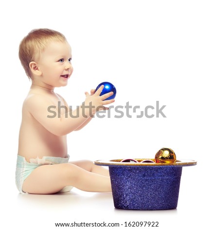 baby playing with christmas balls, isolated on white