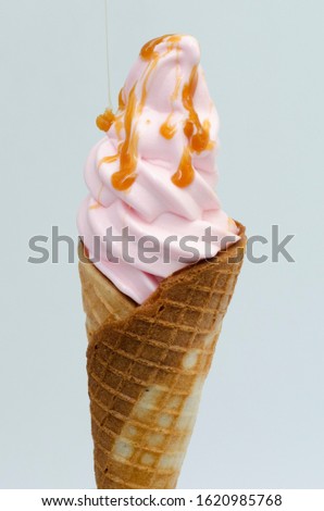 
ice cream cone, with sauce on white background