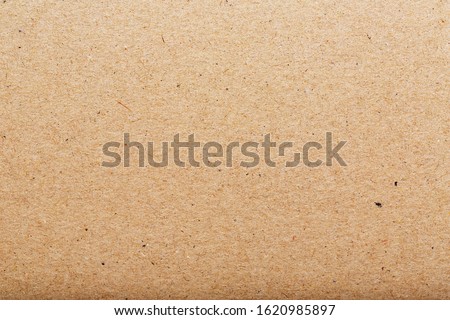 Brown cardboard texture of a blank page. As a background