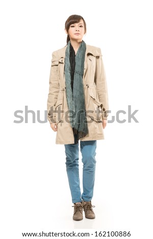 Modern Asian woman with winter coat, full length portrait isolated on white background.