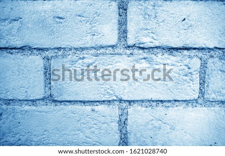 Pattern of brick wall with blur effect in navy blue tone. Abstract architectural background and texture for design.            