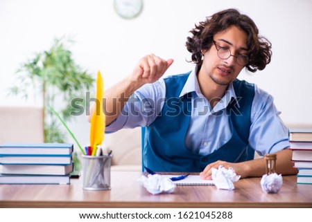 Young writer working on his new work