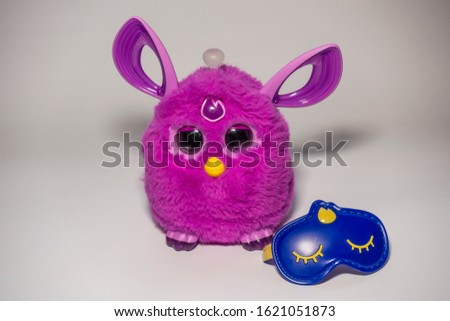 Purple ear toy gift toy interesting different amazing great gift toy buying different perspective angles made of composition on white background.