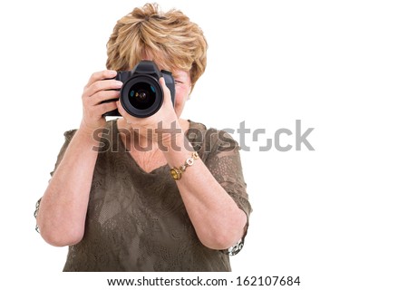 senior female amateur photographer taking photos isolated on white