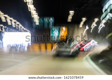 First person view perspective of what drunk driving looks like. A blurry image showing impaired vision while driving a car.  Royalty-Free Stock Photo #1621078459