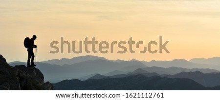 The Summit Success of the Mountaineer in pursuit of adventure
 Royalty-Free Stock Photo #1621112761