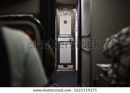 Closed cockpit door on an airplane. Royalty-Free Stock Photo #1621119271