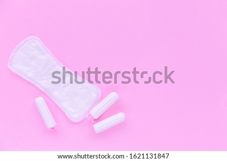 Daily pad and swab on a pink background