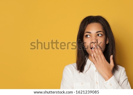 Shocked woman in white shirt looking aside close up portrait
