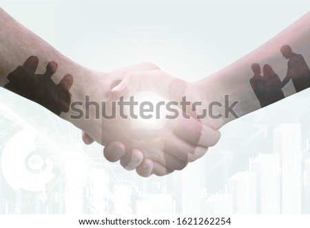 Business handshaking double exposition and silhouette human
